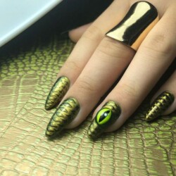 Chrome Ssssssnake Design created by Tracey Lee, Creating texture without feeling texture, this design encapsulates the embossed snake skin design in a super shiny smooth finish. 3D eye element is optional.. Styled in Encapsulated nail art representing Animal Print. These Short - Almond shaped nails are crafted using the Gel system and are coloured Green.